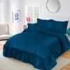 5-Piece Emboss Velvet Quilted Frilled Bridal Bedsheet Set Blue on the bed