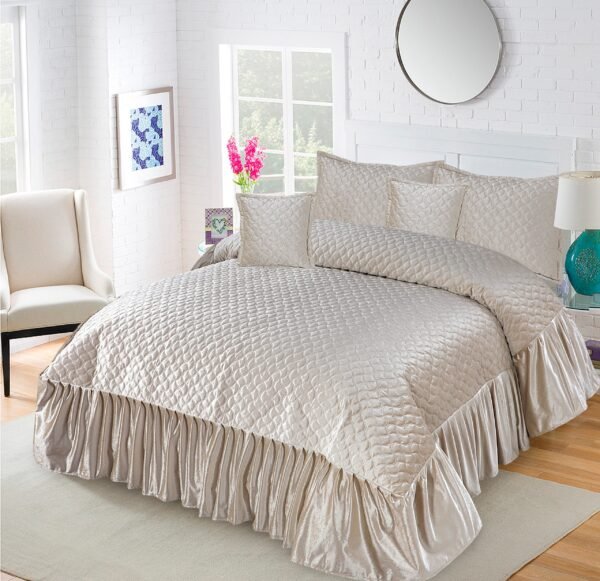 5-Piece Emboss Velvet Quilted Frilled Bridal Bedsheet Set Cream on the bed